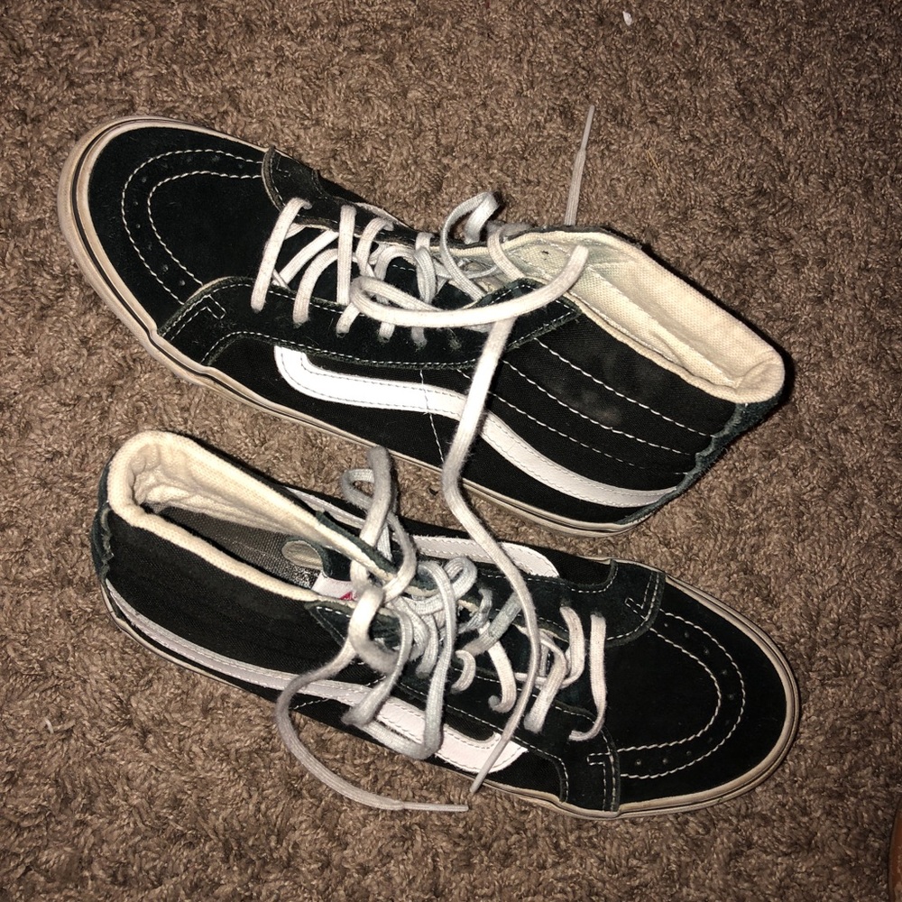 Black and white high top vans